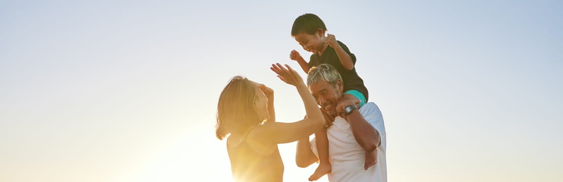 Family enjoying time together on the beach, reflecting the multigenerational planning and legacy-building benefits of 529 savings accounts beyond college funding.