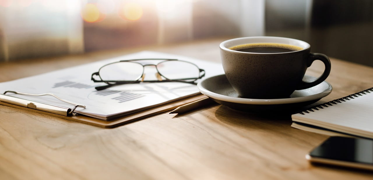 Workspace with retirement planning documents illustrating long-term Social Security planning.